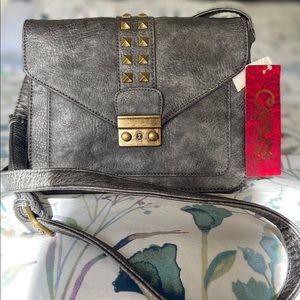 Carlos Santana new handbag with original tag.